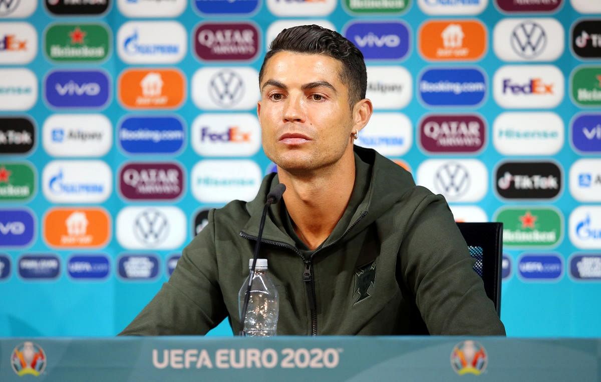 Cristiano Ronaldo after shifting away cola bottles during the press conference. Reuters