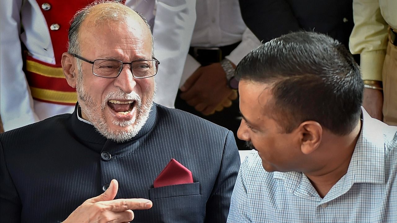 Delhi Lieutenant Governor Anil Baijal as he shares a lighter moment with Delhi Chief Minister Arvind Kejriwal. Credit: PTI Photo