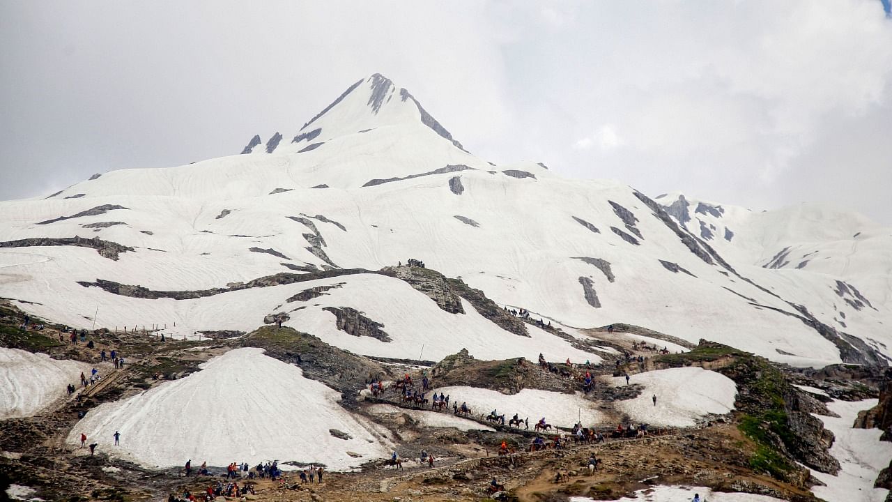 Hindu devotees on their way to the holy cave shrine of Amarnath, near Mahagunas Top in Anantnag district of Jammu and Kashmir, Wednesday, July 17, 2019. Credit: PTI File Photo
