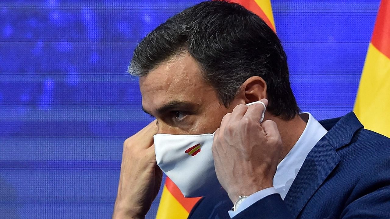 Spain's Prime Minister Pedro Sanchez puts a facemask on during the annual Economic Forum in Barcelona on June 18, 2021. Credit: AFP Photo