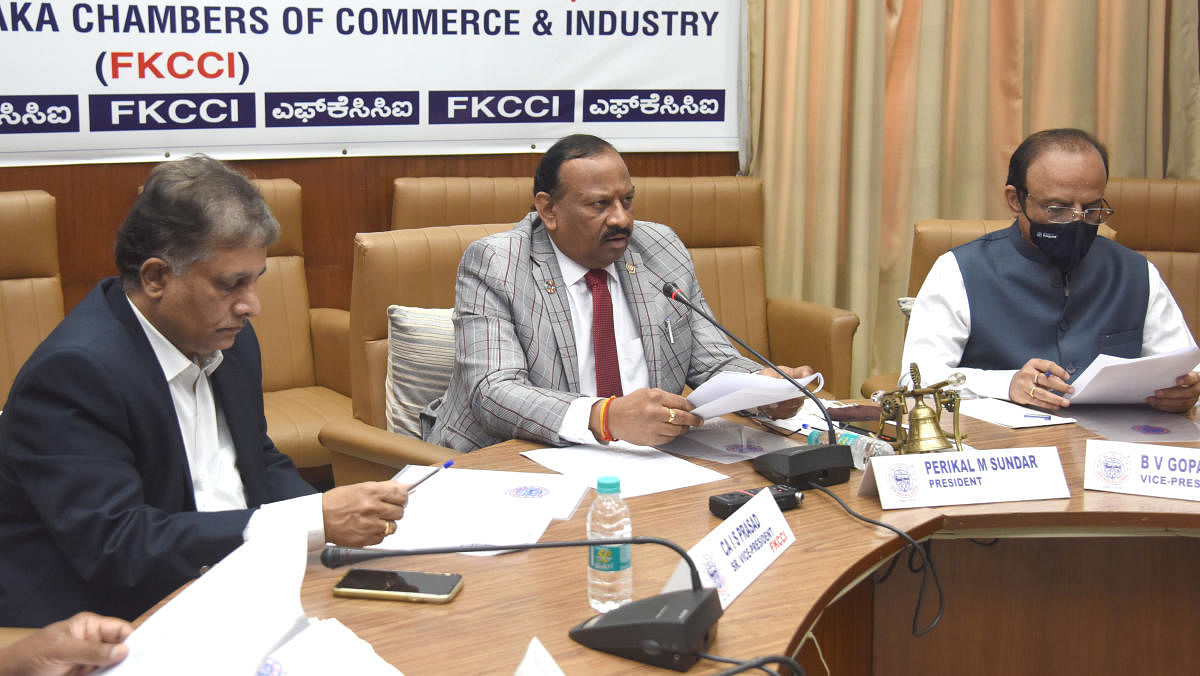 FKCCI president Perikal M Sundar, senior vice-president IS Prasad and vice-president BV Gopal Reddy at a press conference on Thursday. Credit: DH Photo