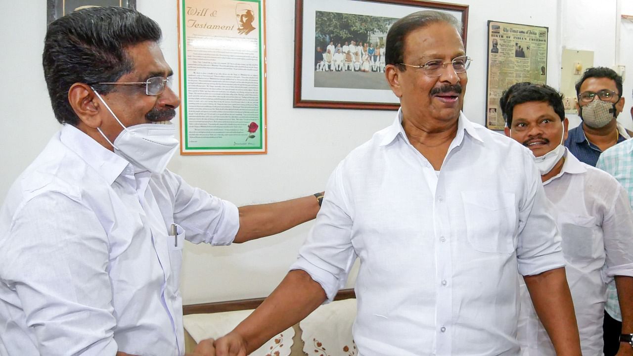 Outgoing KPCC President Mullapally Ramachandran (left) greets his successor K Sudhakaran, at the party office in Thiruvananthapuram, Wednesday, June 9, 2021. Credit: PTI Photo