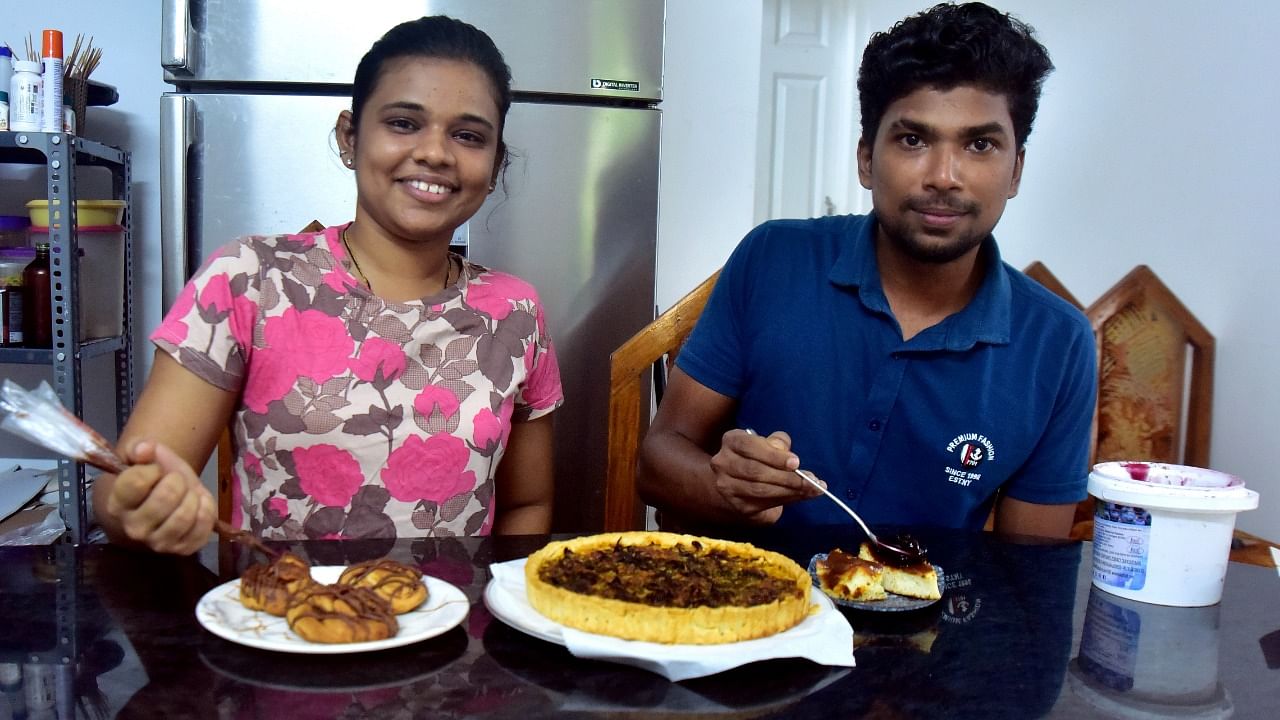 Natasha P and Shreyas Mendon giving final touches to their mouthwatering products. Credit: DH Photo/Govindraj Javali