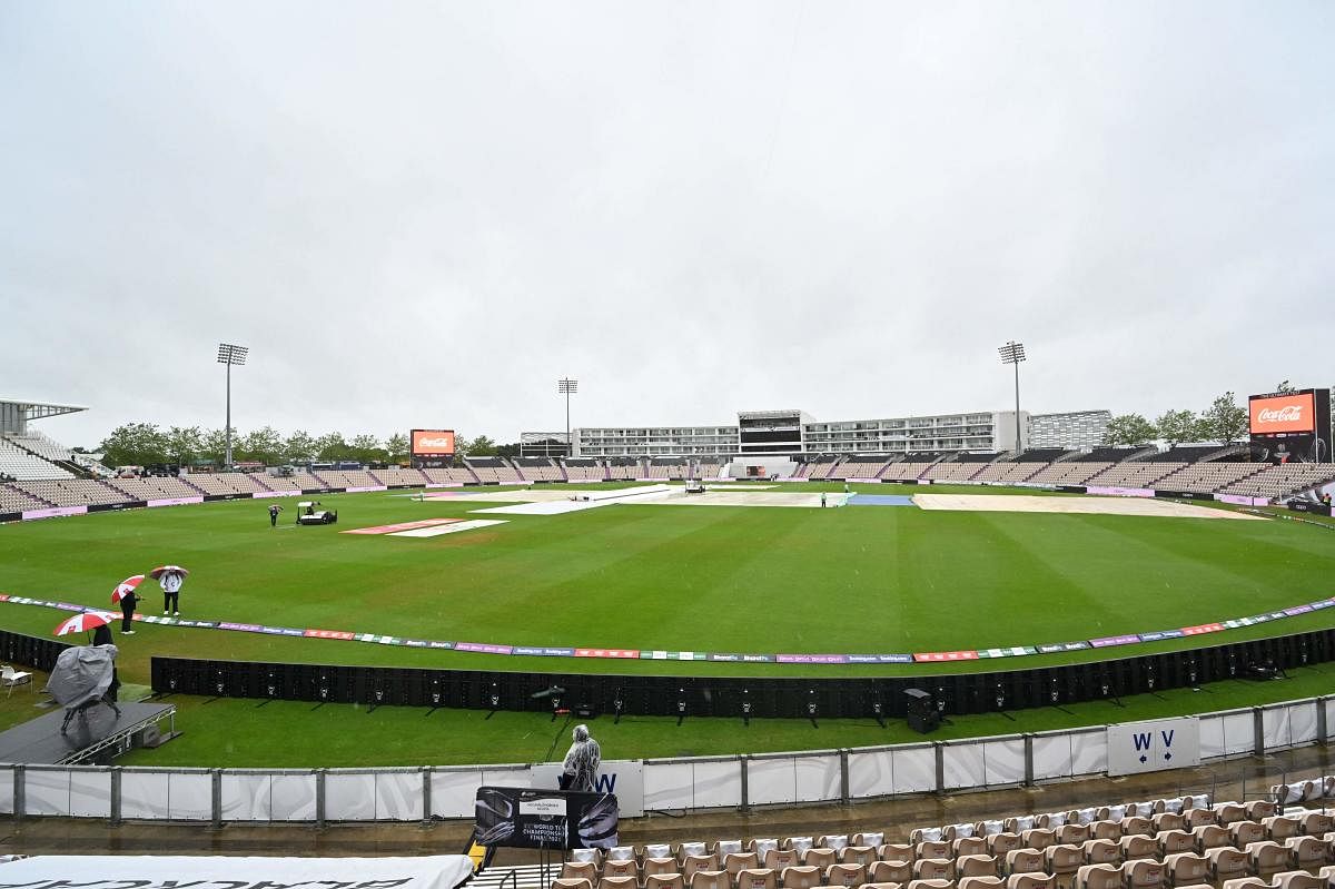 Rain covers remain on the pitch on the first day of the ICC World Test Championship Final between New Zealand and India at the Ageas Bowl in Southampton. Credit: AFP Photo