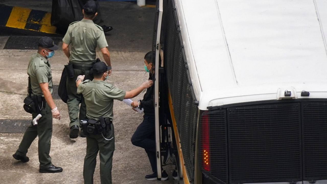 Apple Daily’s editor-in-chief Ryan Law arrives at Lai Chi Kok Reception Centre by a prison van after he remained in custody over the national security law charge, in Hong Kong. Credit: Reuters photo