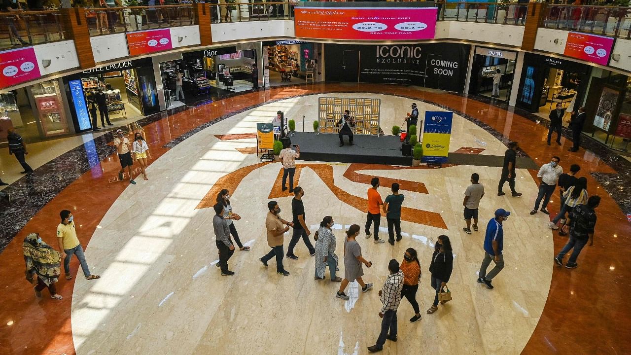 People visit Select City Mall after authorities eased Covid curbs in Delhi. Credit: AFP Photo