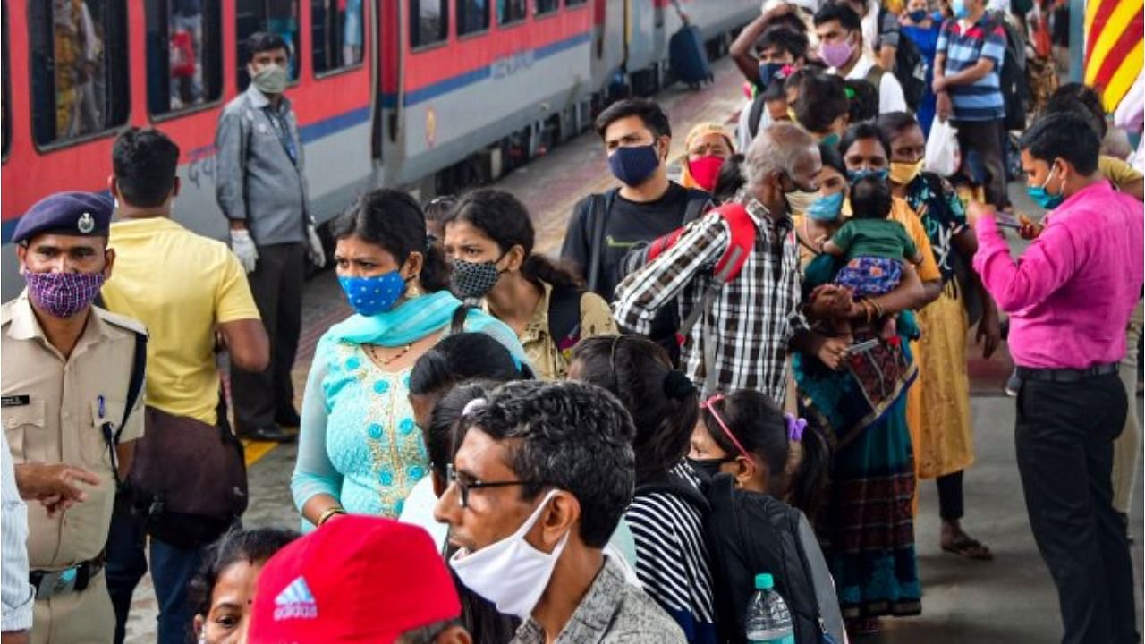 Passengers arriving from Gujarat, wait in a queue for Rapid Antigen Covid-19 test, at Dadar Station in Mumbai. Credit: PTI File Photo