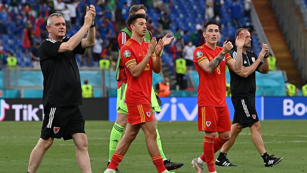 Wales' Ethan Ampadu and Harry Wilson applaud fans after the match. Credit: Reuters photo