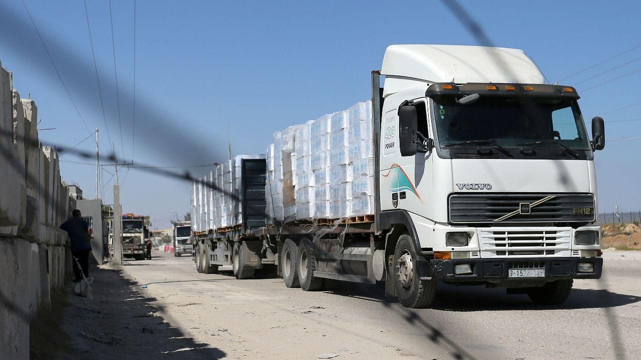 A truck carrying goods is seen through a fence after Israel reopened Kerem Shalom crossing in Rafah. Credit: Reuters file photo