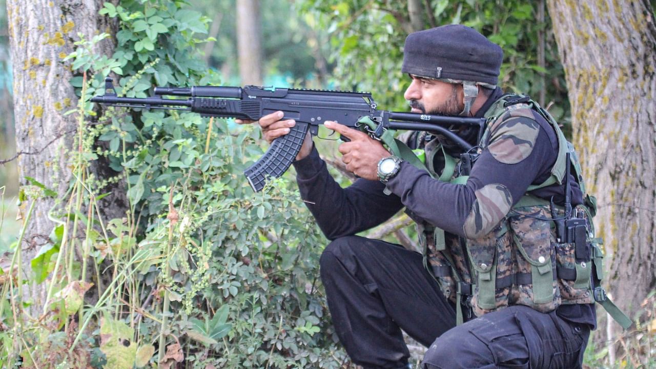 A security personnel during an encounter at Sopore in Baramulla district, Monday, June 21, 2021. Credit: PTI Photo