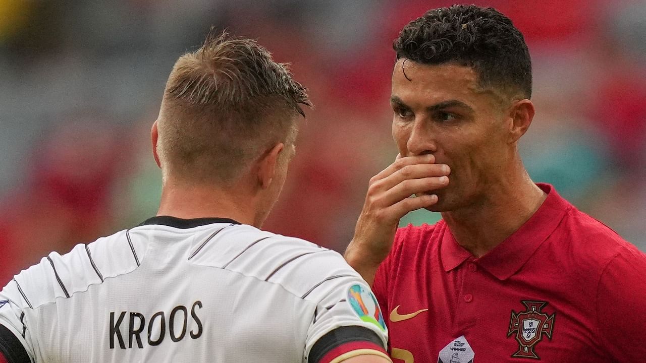 Former Madrid teammates Ronaldo (R) and Kroos during Portugal's game with Germany. Credit: AFP Photo