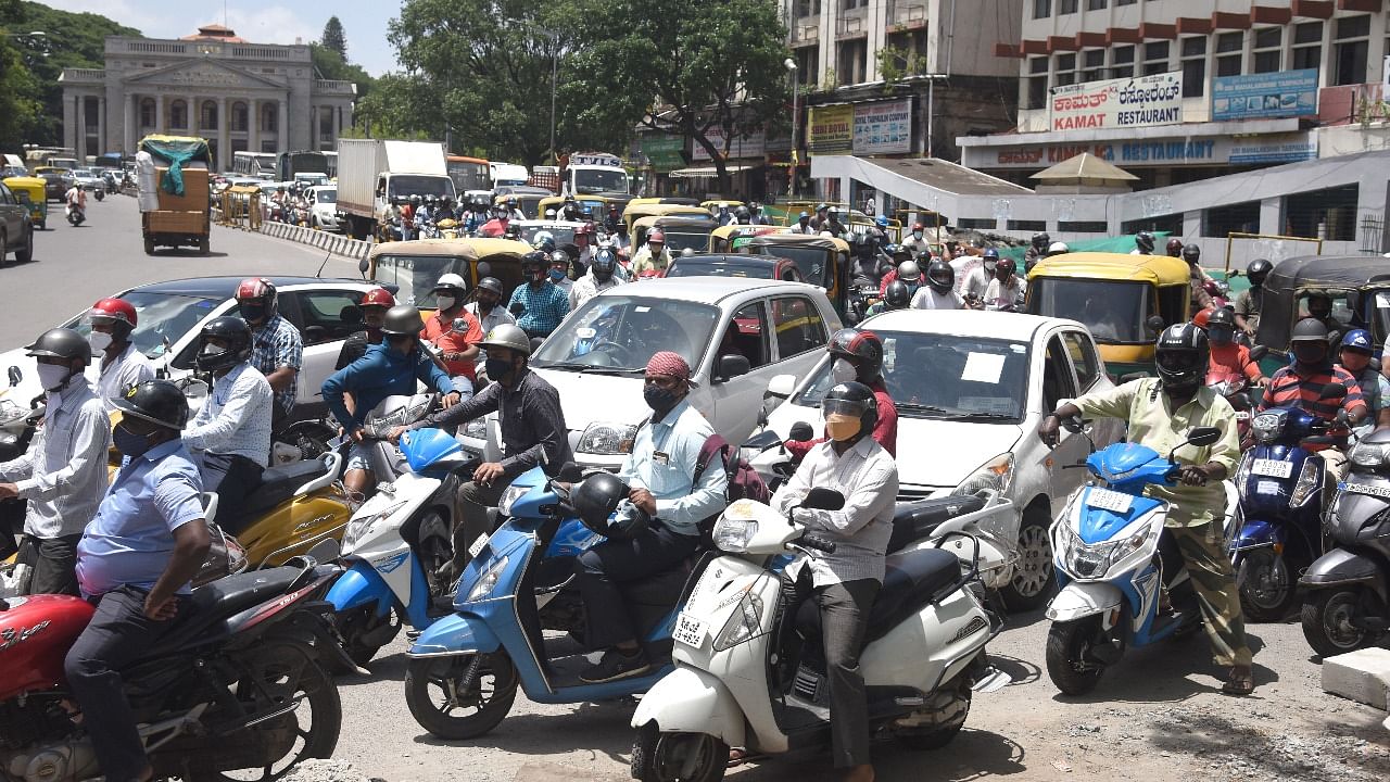 Traffic was paralysed in front of Town Hall, NR Road and SJP Road after Unlock 2.0 in Bengaluru on Monday. Credit: DH Photo/S K Dinesh