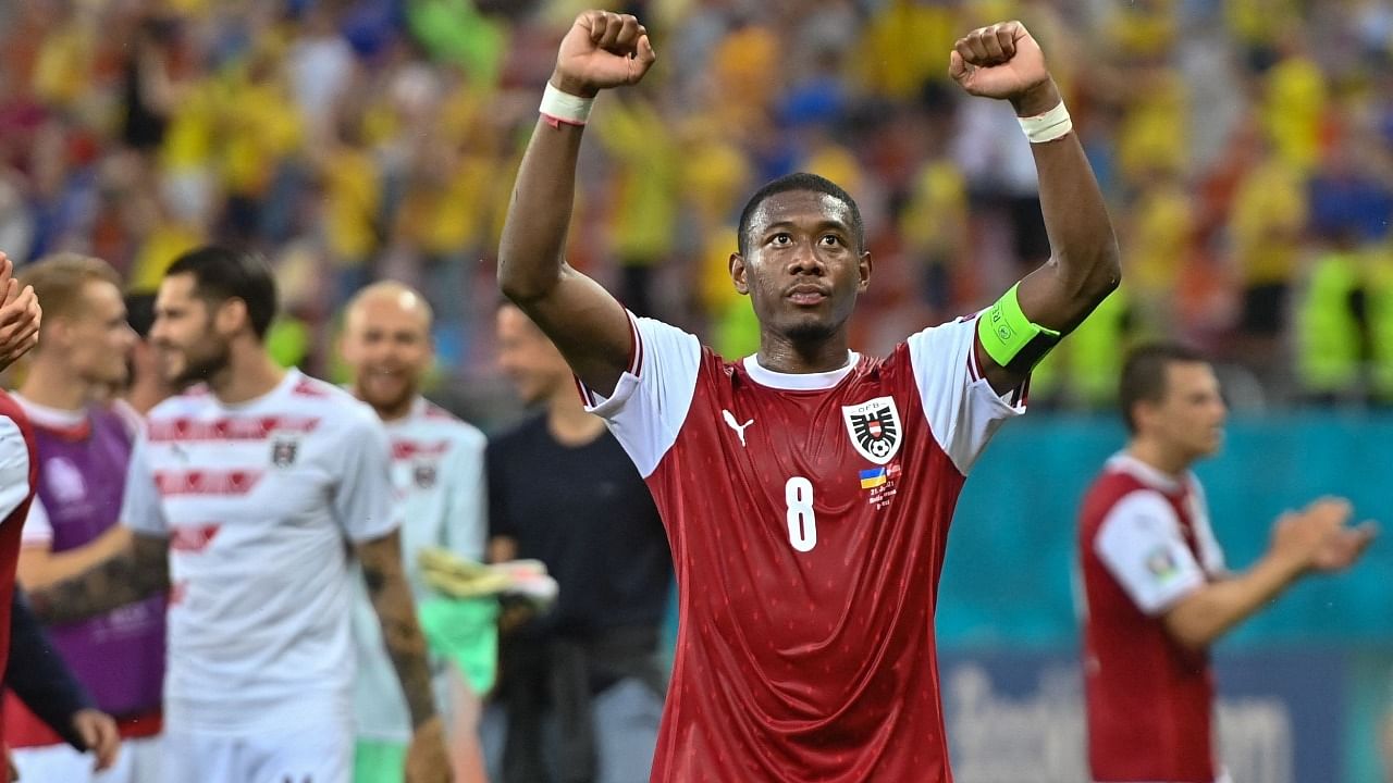 Austria's defender David Alaba celebrates after winning the UEFA EURO 2020 Group C football match between Ukraine and Austria at the National Arena in Bucharest. Credit: AFP Photo