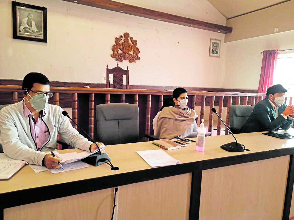 Deputy Commissioner Charulata Somal chairs a meeting in Madikeri on Monday. Credit: special arrangement