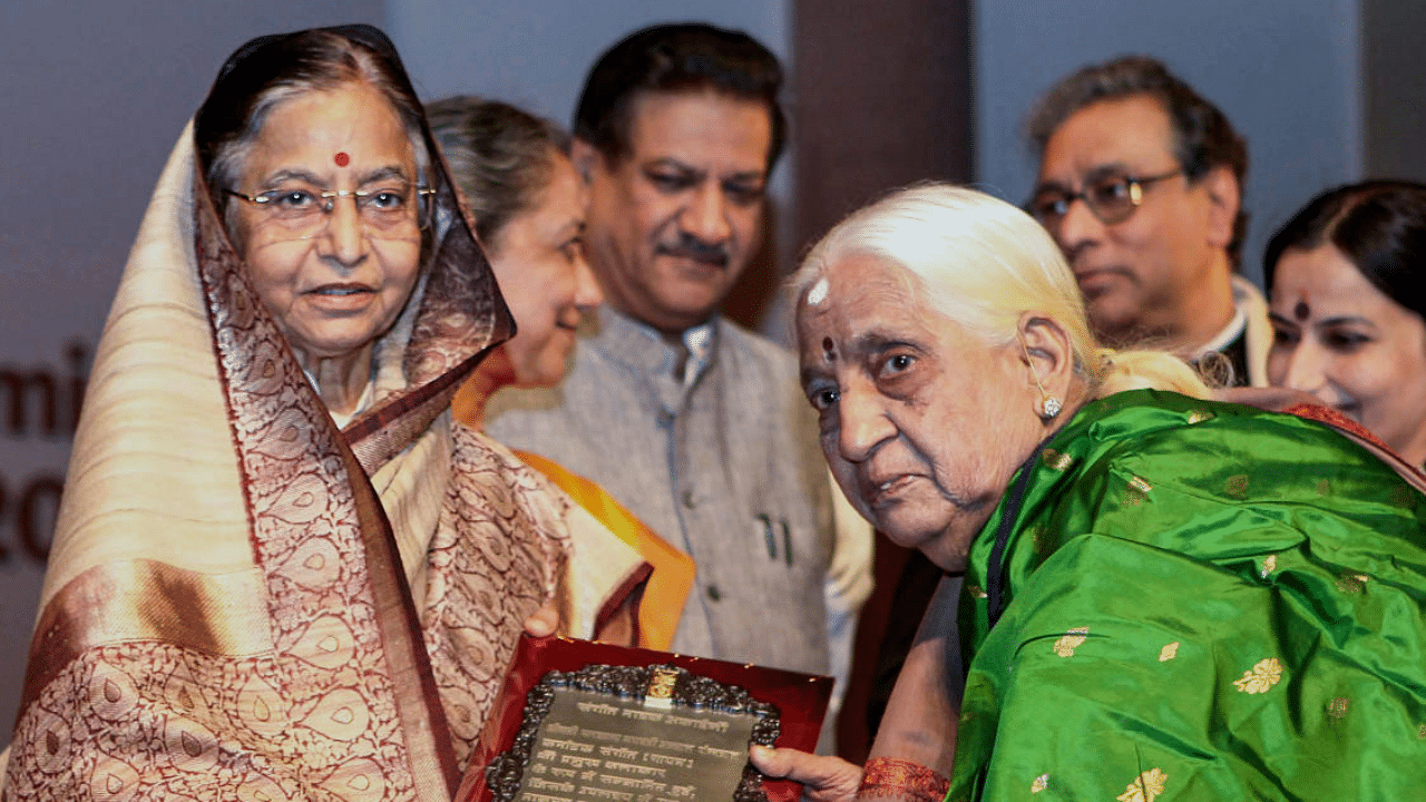 Former President Pratibha Patil presenting the Sangeet Natak Akademi Award 2009 for Carnatic Music (Vocal) to Parassala B Ponnammal (L). Credit: PTI File Photo