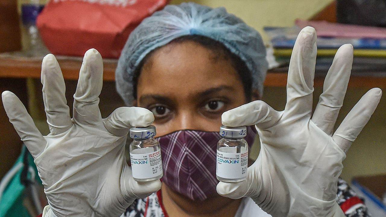 A health worker shows the vials fo Covaxin dose, at a vaccination centre in Kolkata, Tuesday, June 22, 2021. Credit: PTI Photo