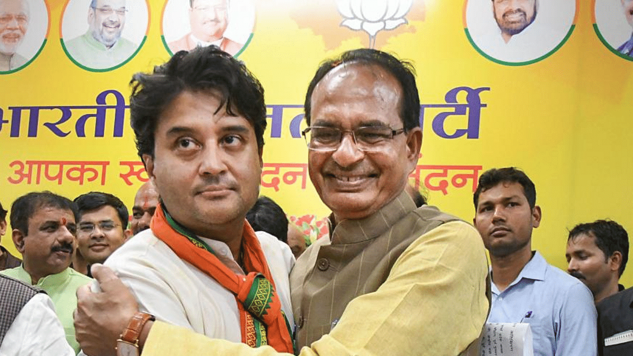 BJP leader Jyotiraditya Scindia with Madhya Pradesh Chief Minister Shivraj Singh Chauhan. Credit: PTI File Photo