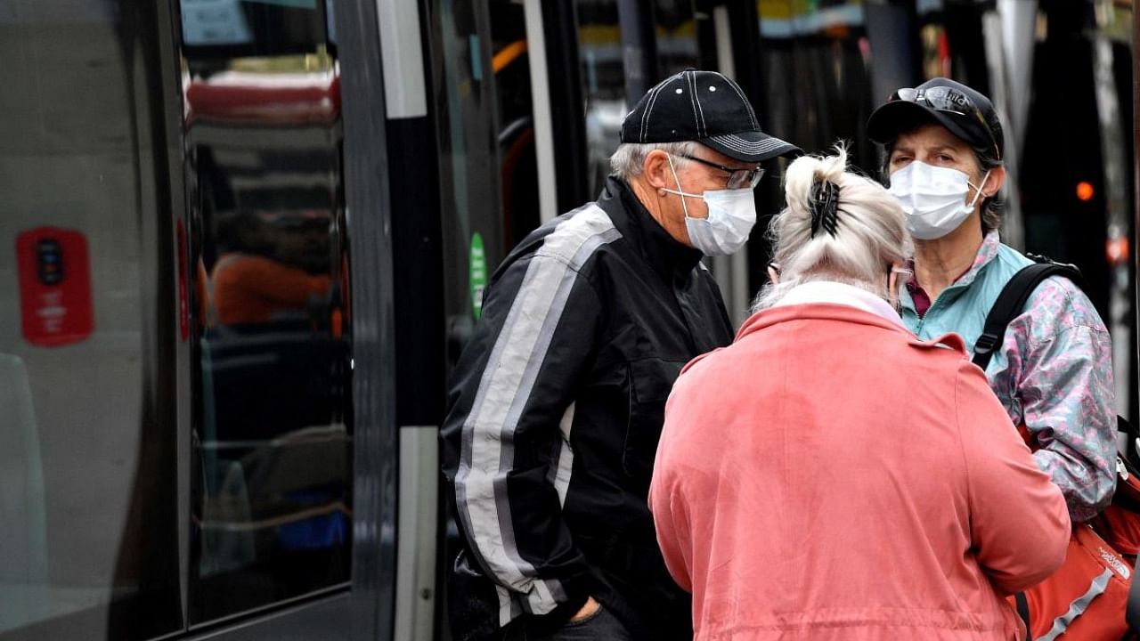Passengers wearing face masks wait at a metro station in Sydney on June 23, 2021, as residents were largely banned from leaving the city to stop a growing outbreak of the highly contagious Delta Covid-19 variant spreading to other regions. Credit: AFP Photo