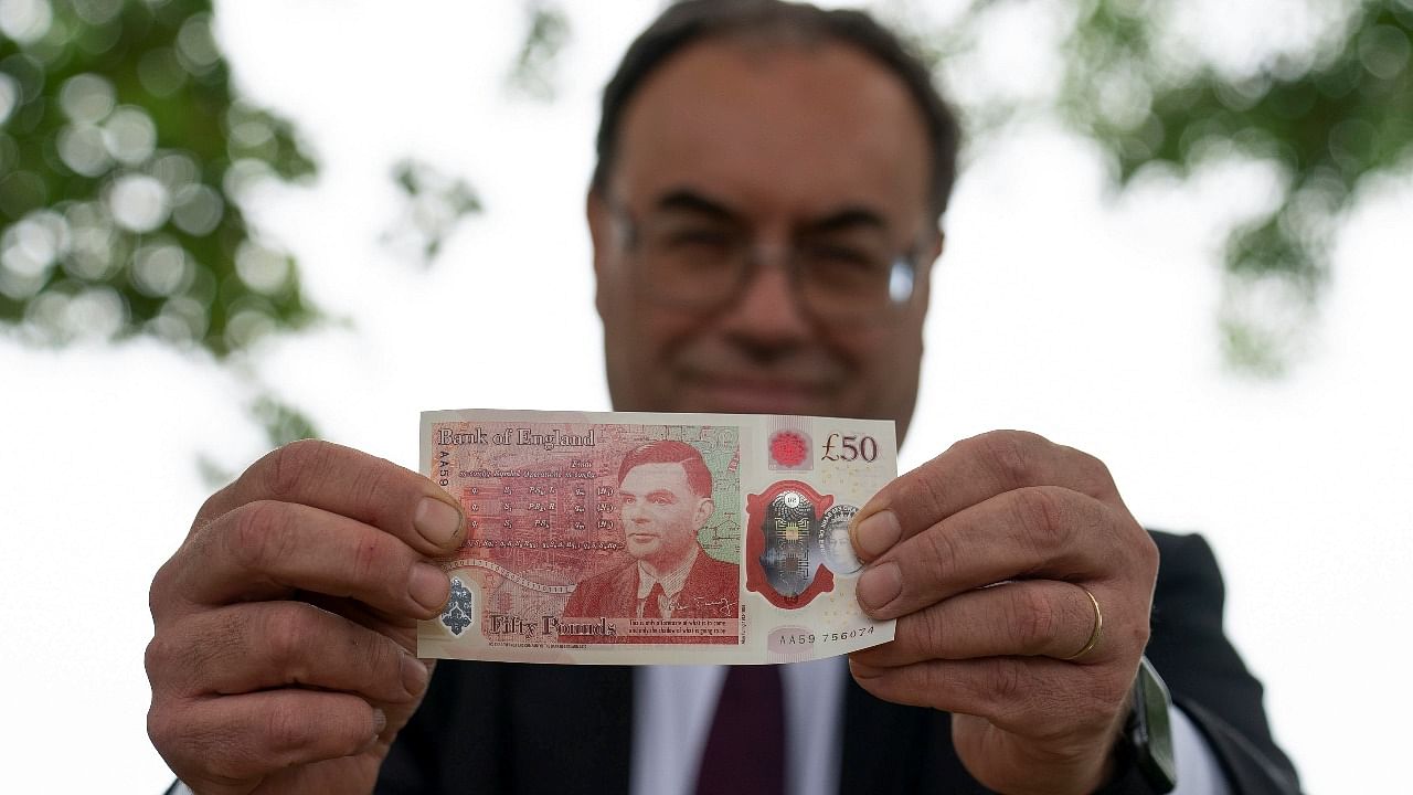 Bank of England Governor Andrew Bailey holds the new £50 note, which features Alan Turing, at Bletchley Park in Milton Keynes. Credit: Reuters photo