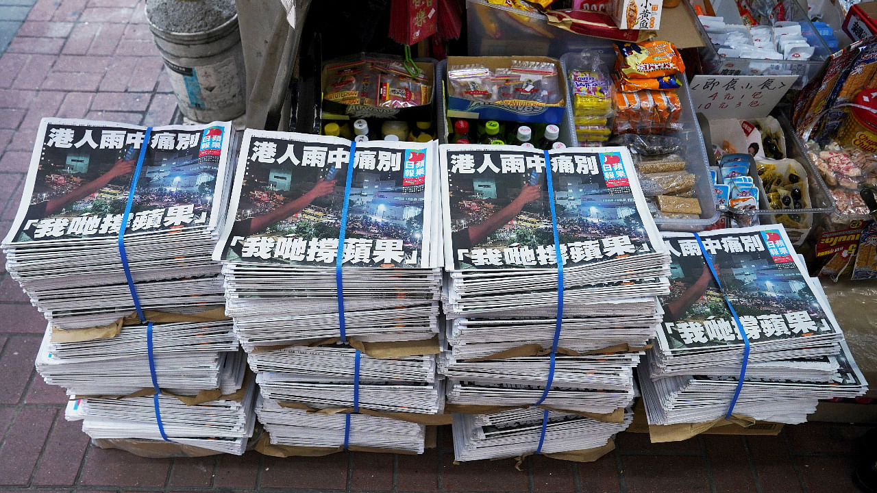 Copies of the final edition of Apple Daily, published by Next Digital, are seen at a newsstand in Hong Kong. Credit: Reuters Photo