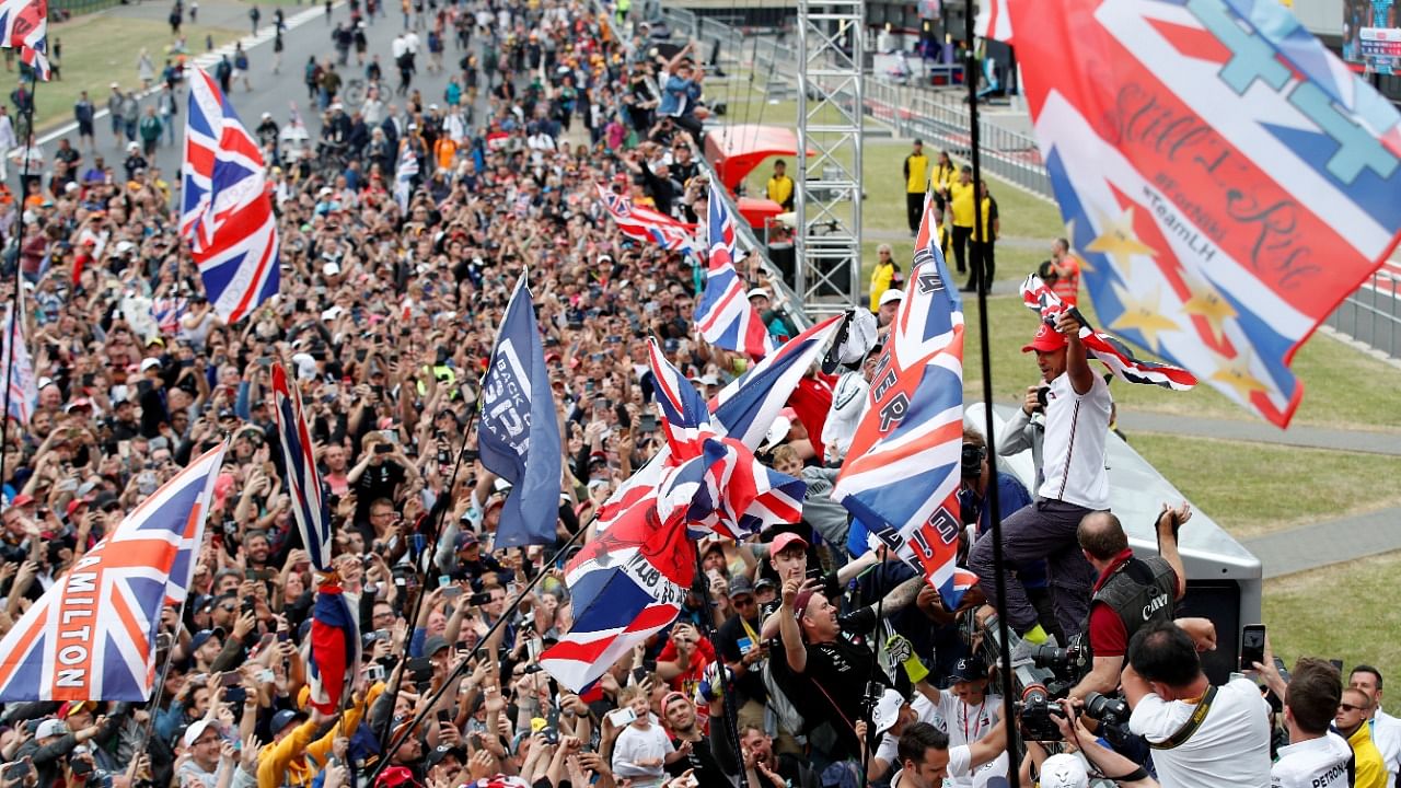 Lewis Hamilton celebrates in front of the crowd after winning the race at Silverstone Circuit in 2019. Credit: Reuters File Photo