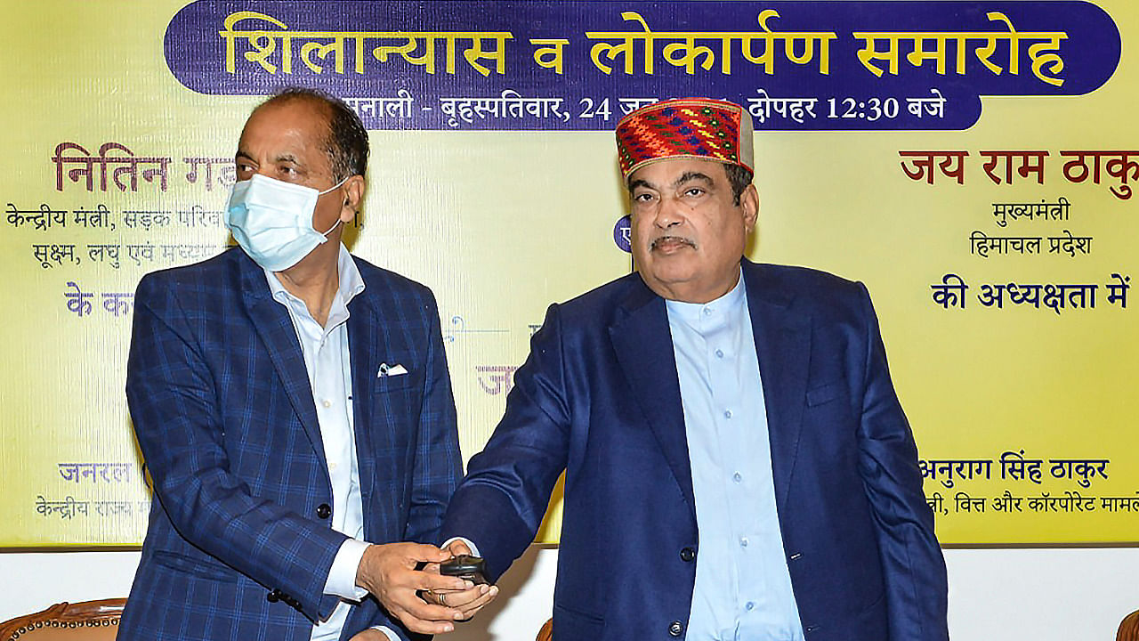 Nitin Gadkari and Chief Minister of H.P Jai Ram Thakur during the foundation laying of 9 road projects worth Rs. 6155 crore for Himachal Pradesh virtually from Manali in Kullu district. Credit: PTI Photo