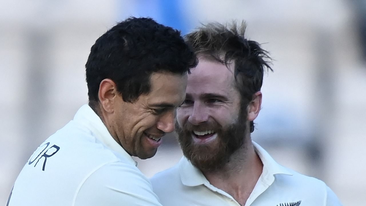 New Zealand's Ross Taylor (L) and New Zealand's captain Kane Williamson celebrate victory on the final day of the ICC World Test Championship Final between New Zealand and India at the Ageas Bowl in Southampton. Credit: AFP Photo