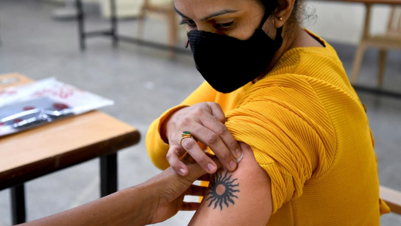A student going abroad gets the Covid vaccine at Central College on Wednesday. Credit: DH Photo/Pushkar V