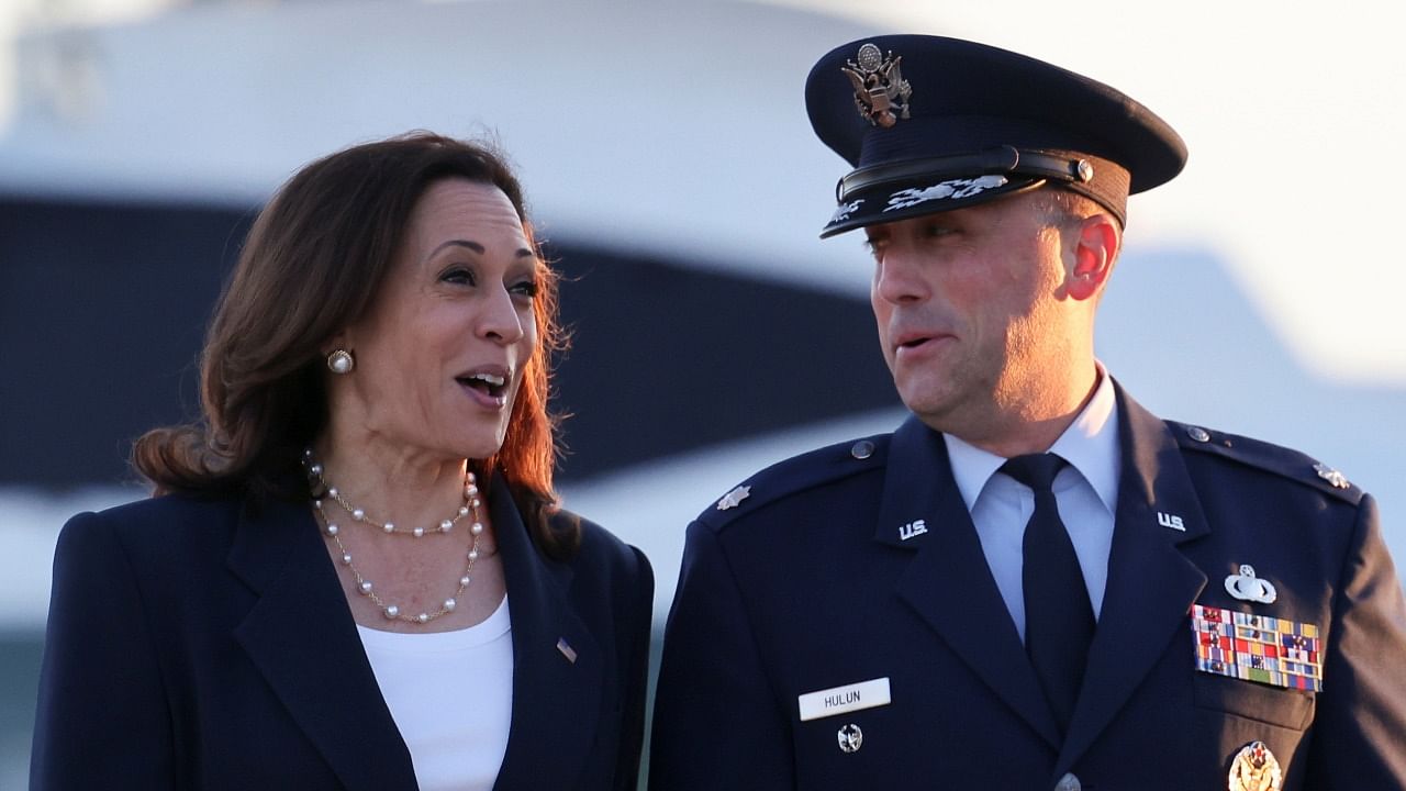 US Vice President Kamala Harris speaks to Lt. Col Richard "Rick" Hulun, 89th Maintenance Group Deputy, as she boards Air Force Two to travel to El Paso, Texas. Credit: Reuters Photo