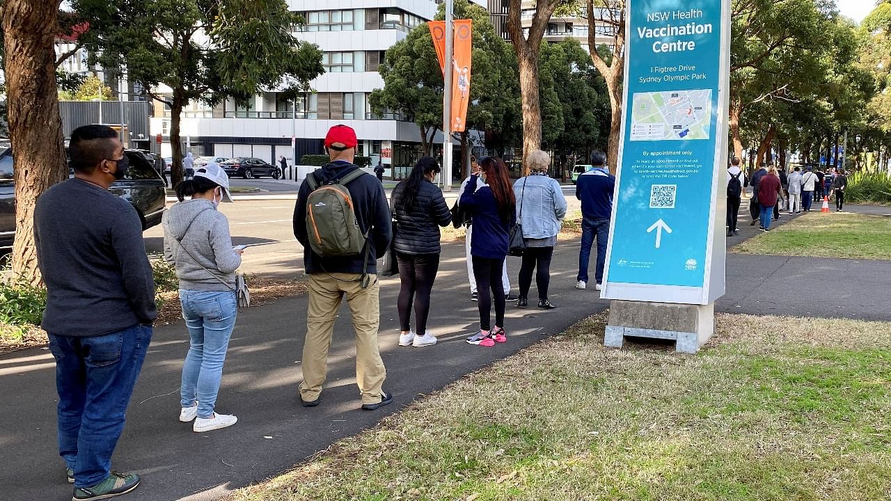 People wait in line outside a Covid-19 vaccination centre at Sydney Olympic Park in Sydney. Credit: Reuters photo