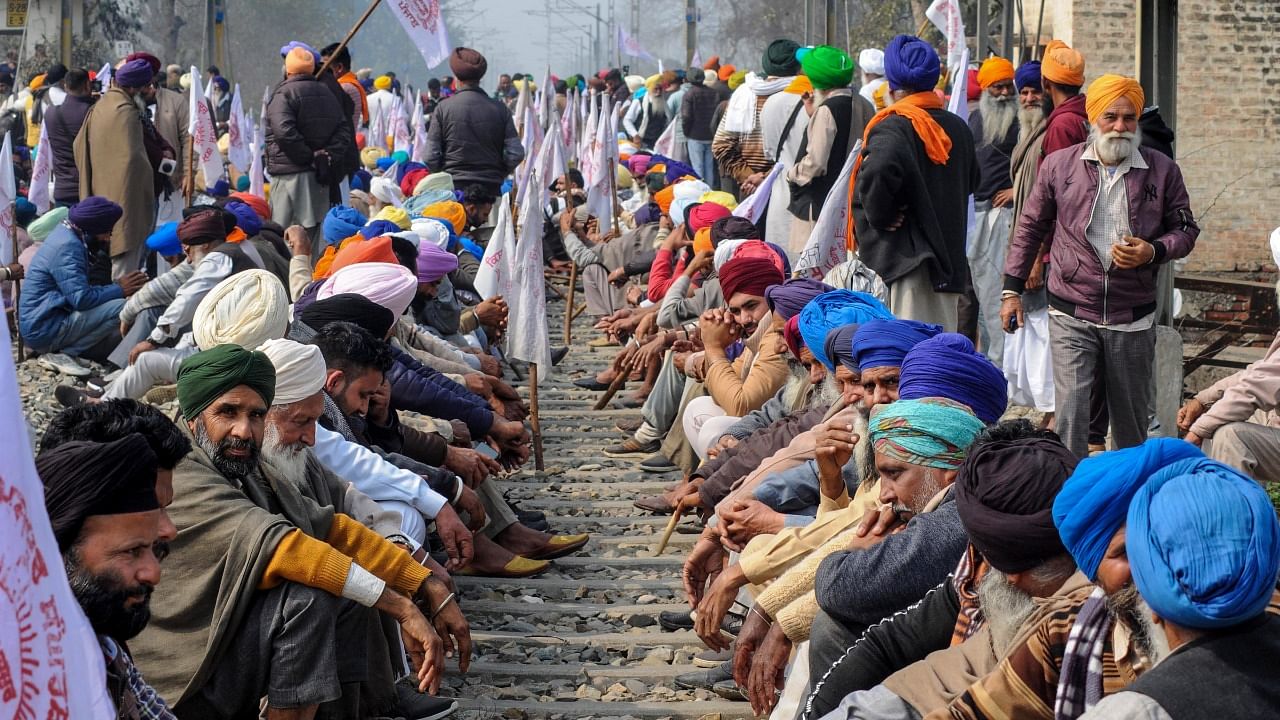 Members of various farmer organisations block a railway track during a four-hour 'rail roko' demonstration across the country, called by Samyukta Kisan Morcha (SKM), as part of their agitation against Centre's farm reform laws, in Amritsar district, February 18, 2021. Credit: PTI File Photo