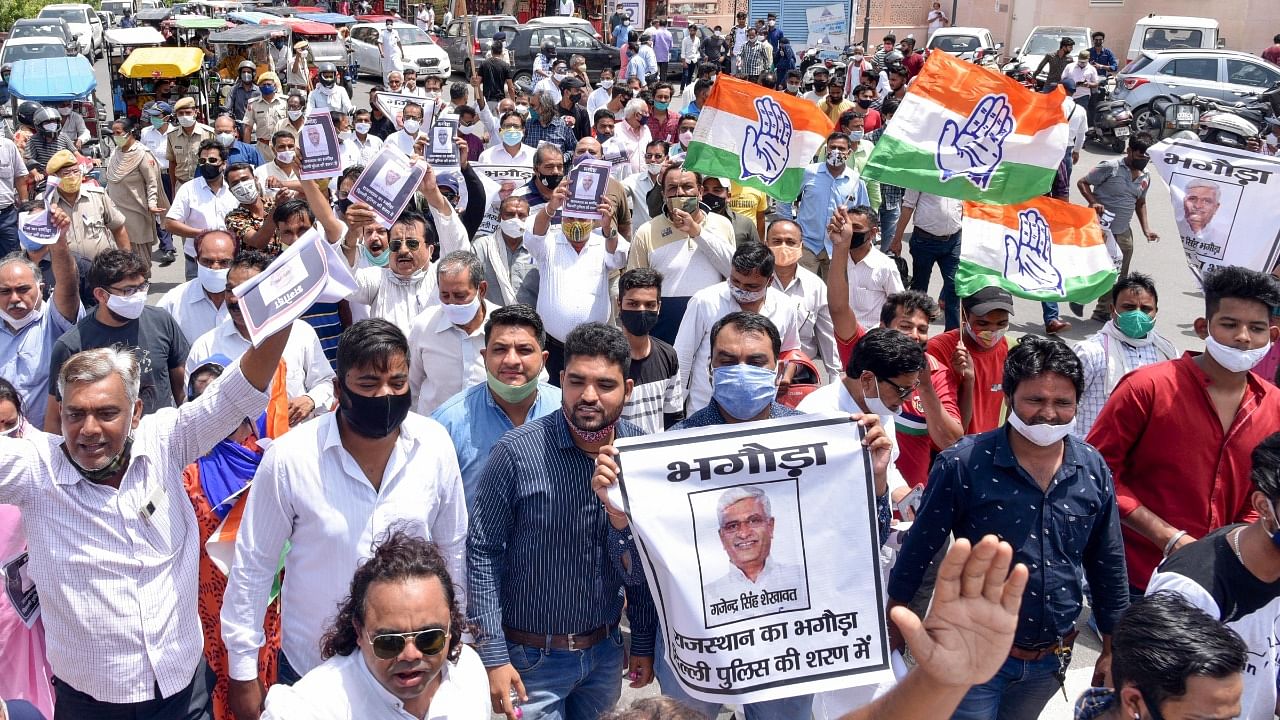 Congress workers stage a protest against Union minister Gajendra Singh Shekhawat following summons to the party's chief whip Mahesh Joshi by Delhi Police in a phone tapping case, in Jaipur, Friday, June 25, 2021. Credit: PTI Photo