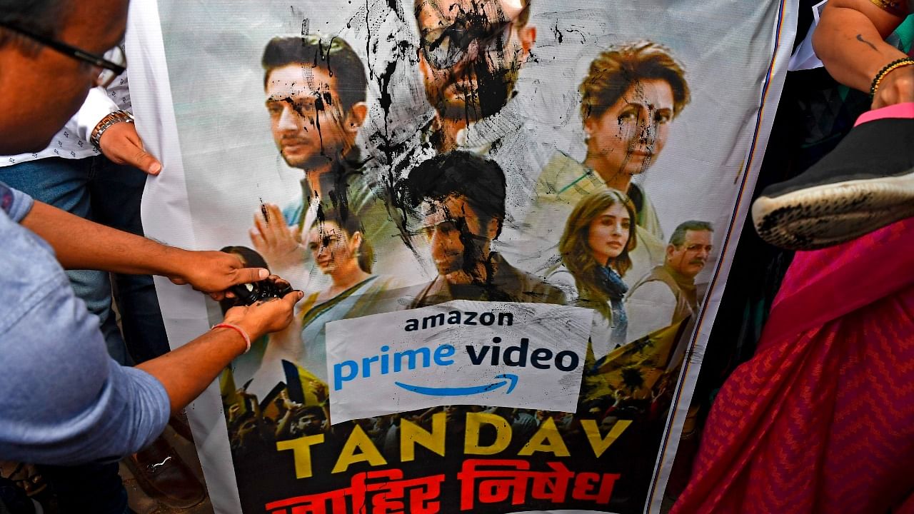 Supporters of India's ruling Bharatiya Janata Party (BJP) pour ink and beat a poster with footwear during a protest against a new web series 'Tandav', in Mumbai. Credit: AFP Photo