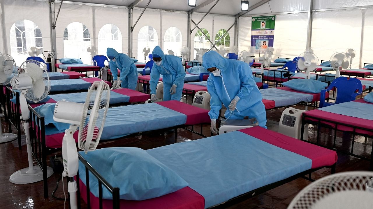 Health workers arrange oxygen concentrator machines at a newly inaugurated Covid-19 coronavirus centre in Chennai on June 8, 2021. Credit: AFP Photo