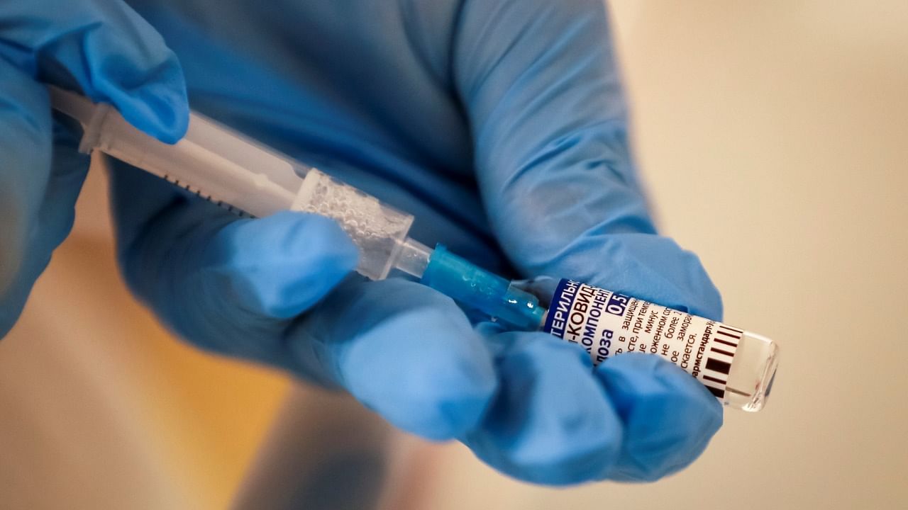 A healthcare worker prepares a dose of Sputnik V Covid-19 vaccine. Credit: Reuters Photo