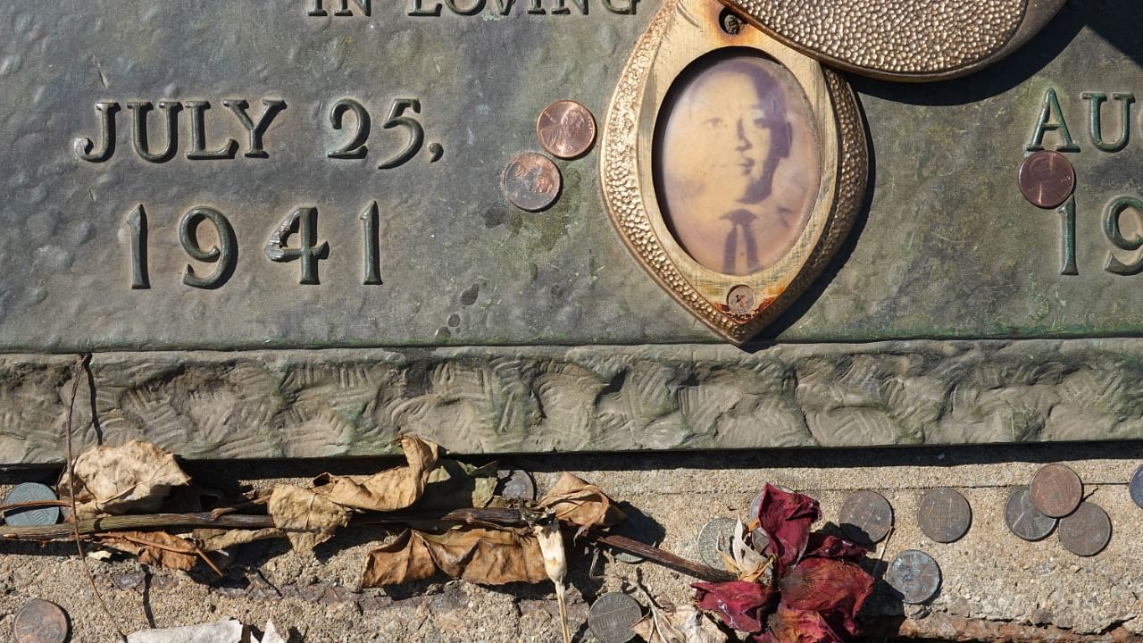 A faded photograph is attached to the headstone that marks the gravesite of Emmett Till in Burr Oak Cemetery on March 22, 2021 in Chicago, Illinois. Credit: Getty Images