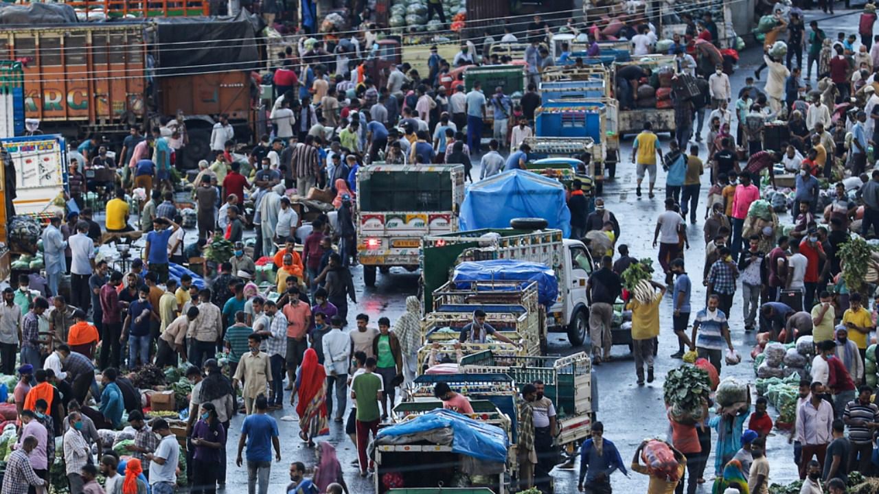 People throng markets in Jammu as Covid-19 curbs are relaxed after a dip in cases. Credit: PTI Photo
