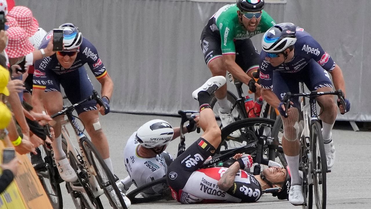 Team Lotto Soudal's Caleb Ewan of Australia and Team Bora Hansgrohe's Peter Sagan of Slovakia (rear C) fall. Credit: AFP Photo