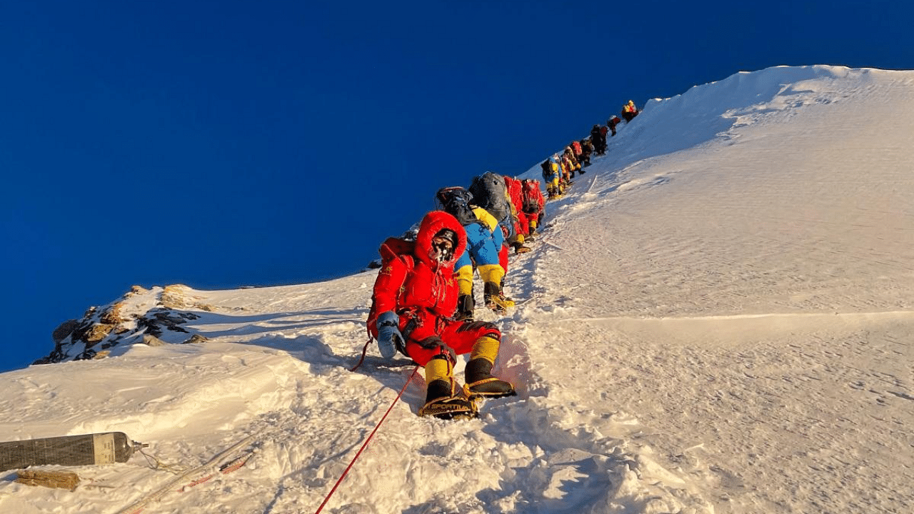 Mountaineers as they climb during their ascend to summit Mount Everest (8,848.86-metre), in Nepal. Credit: AFP File Photo