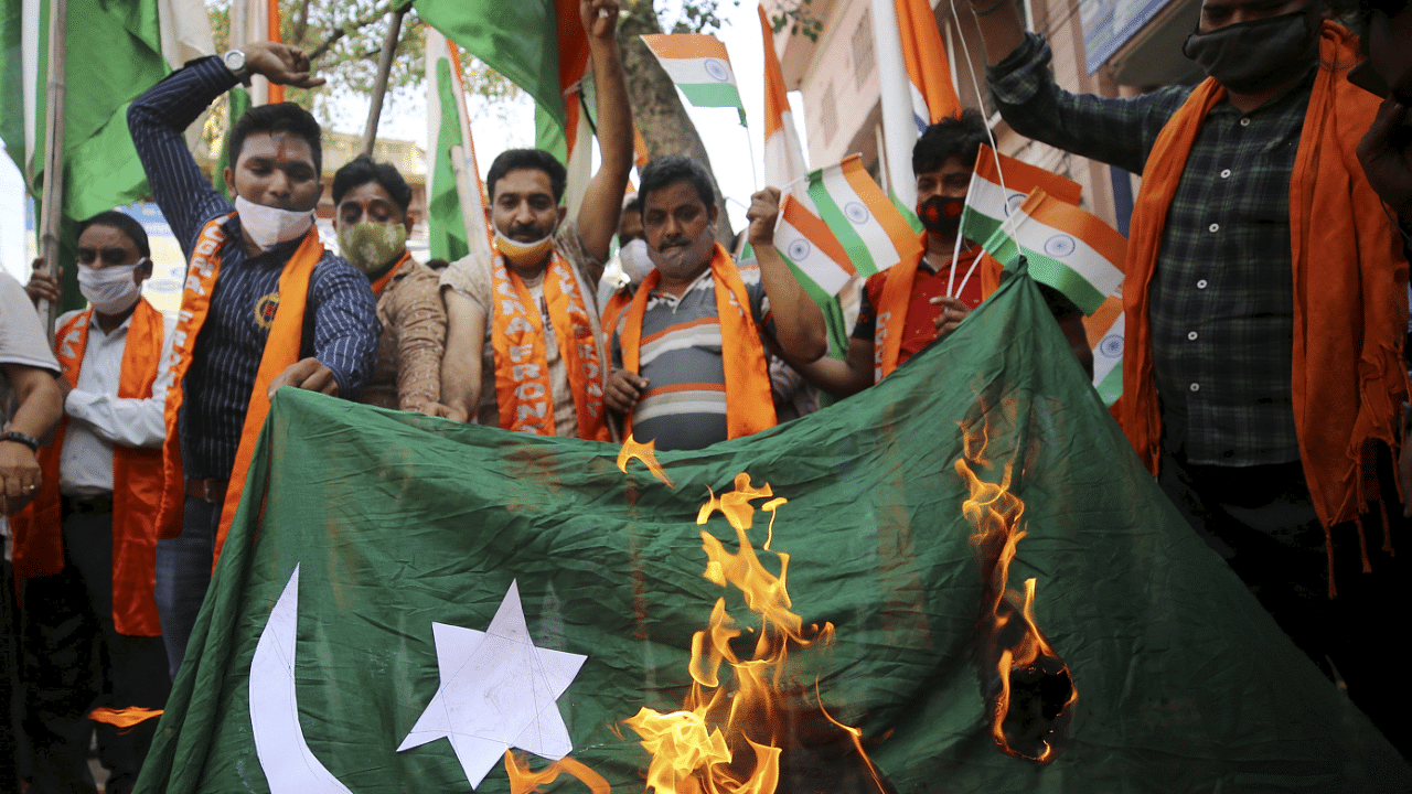 Shiv Sena Dogra Front (SSDF) activists burn a Pakistani flag as they stage a protest in Jammu. Credit: PTI Photo