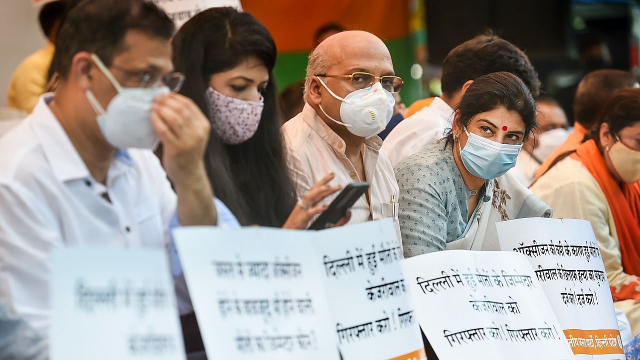 BJP leaders stage a protest over Delhi's oxygen shortage in hospitals during the second wave of coronavirus epidemic in India, at Jantar Mantar in New Delhi. Credit: PTI Photo