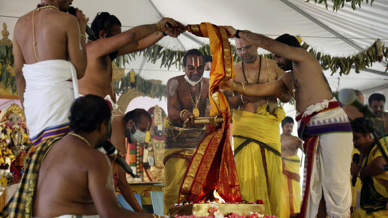 Sri Venkateswara Temple head priest Samudrala Venkatacharyulu, center, leads the Maha Kumbhabhishekam rituals on the fifth and final day of the Hindu rededication ceremony in Penn Hills. Credit: AP Photo