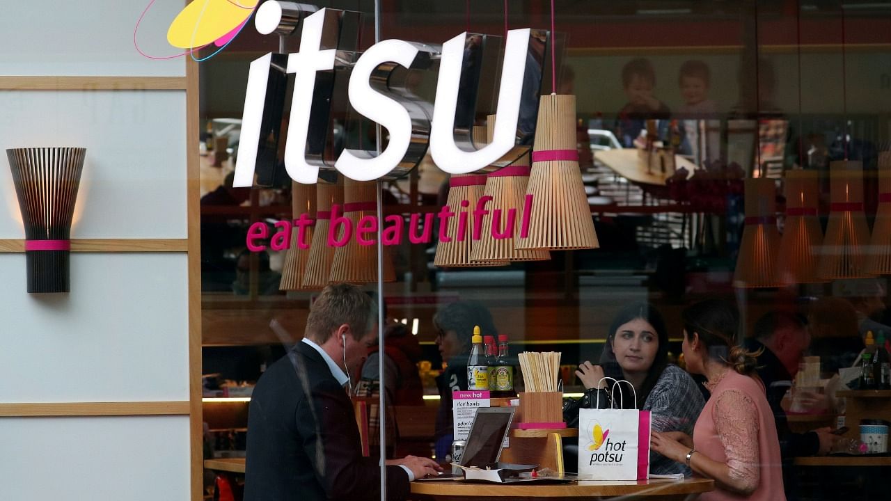 Customers eat inside an Itsu restaurant, a company in which private-equity firm Bridgepoint is invested, in London. Credit: Reuters file photo
