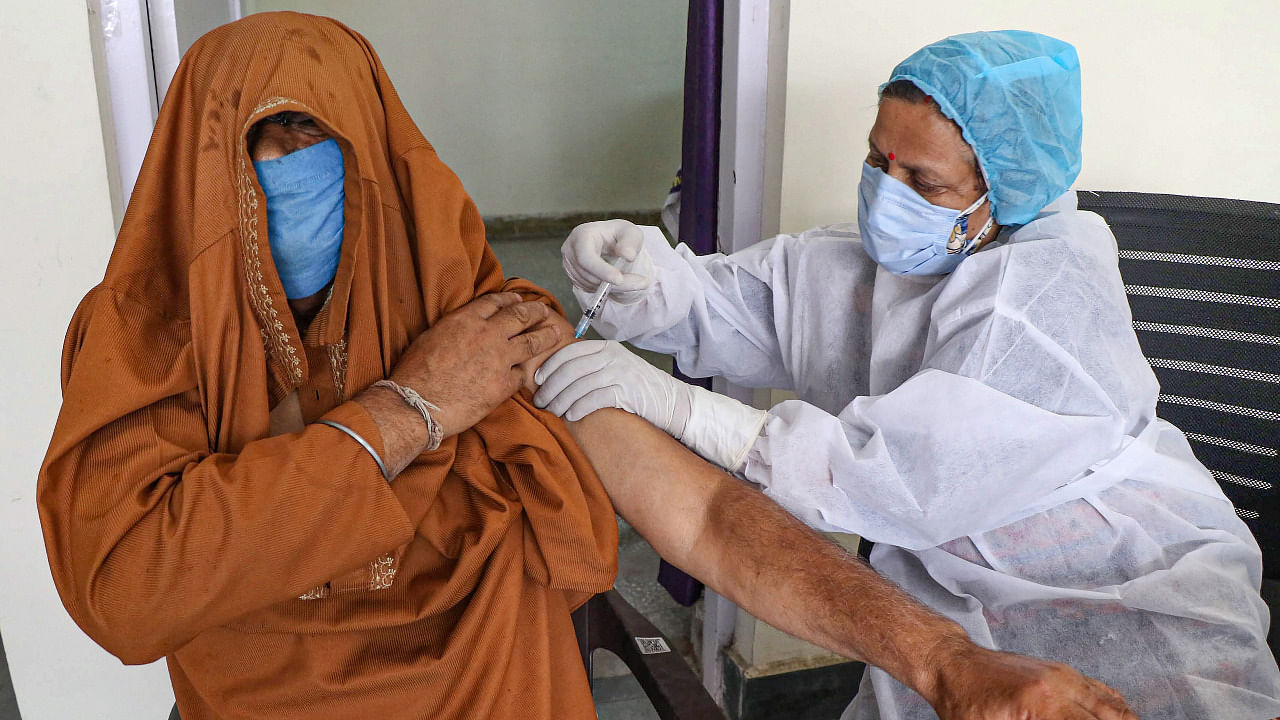 A person gets a dose of a Covid-19 vaccine in J&K. Credit: PTI Photo