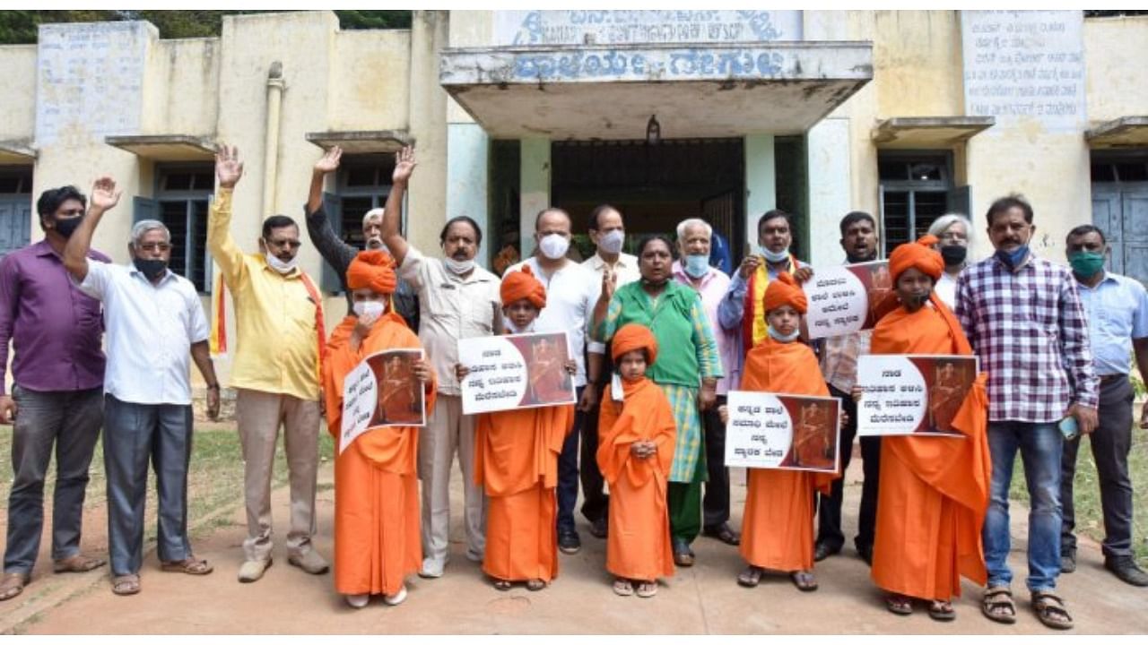 Members of NTM School Ulisi Horata Samiti stage a protest in front of NTM School in Mysuru on Wednesday. Credit: DH Photo