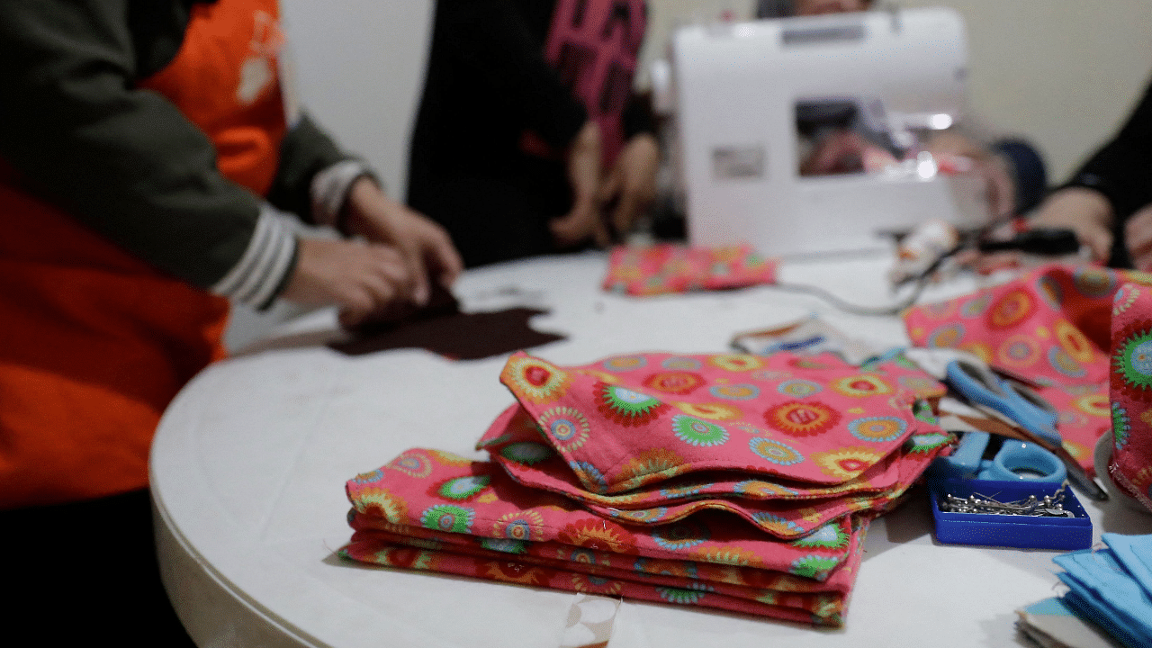 WingWoman Lebanon stitch reusable sanitary pads out of colourful cloth in the Palestinian refugee camp of Shatila. Credit: AFP Photo
