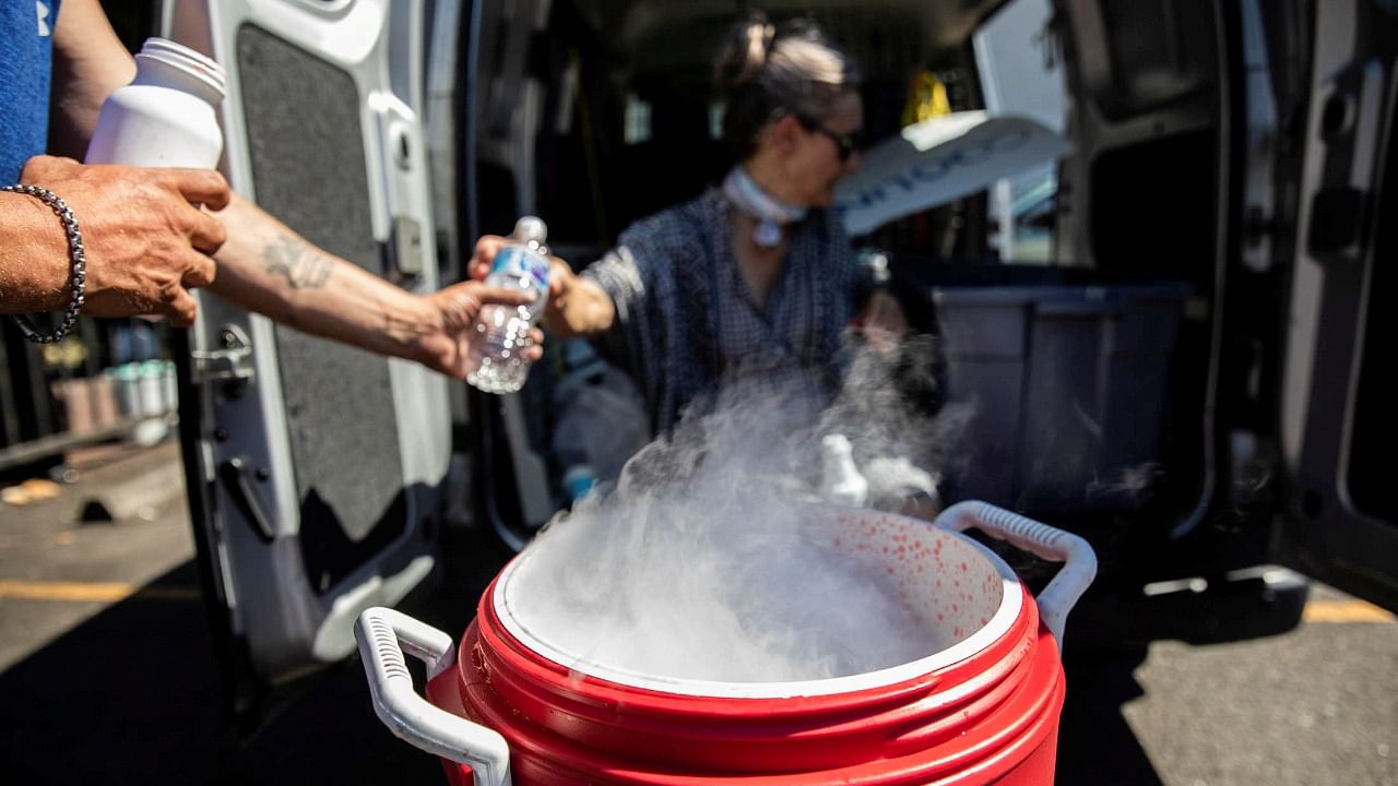 People use dry ice to cool water and Gatorade due to an ice shortage during an unprecedented heat wave in Portland. Credit: Reuters File Photo