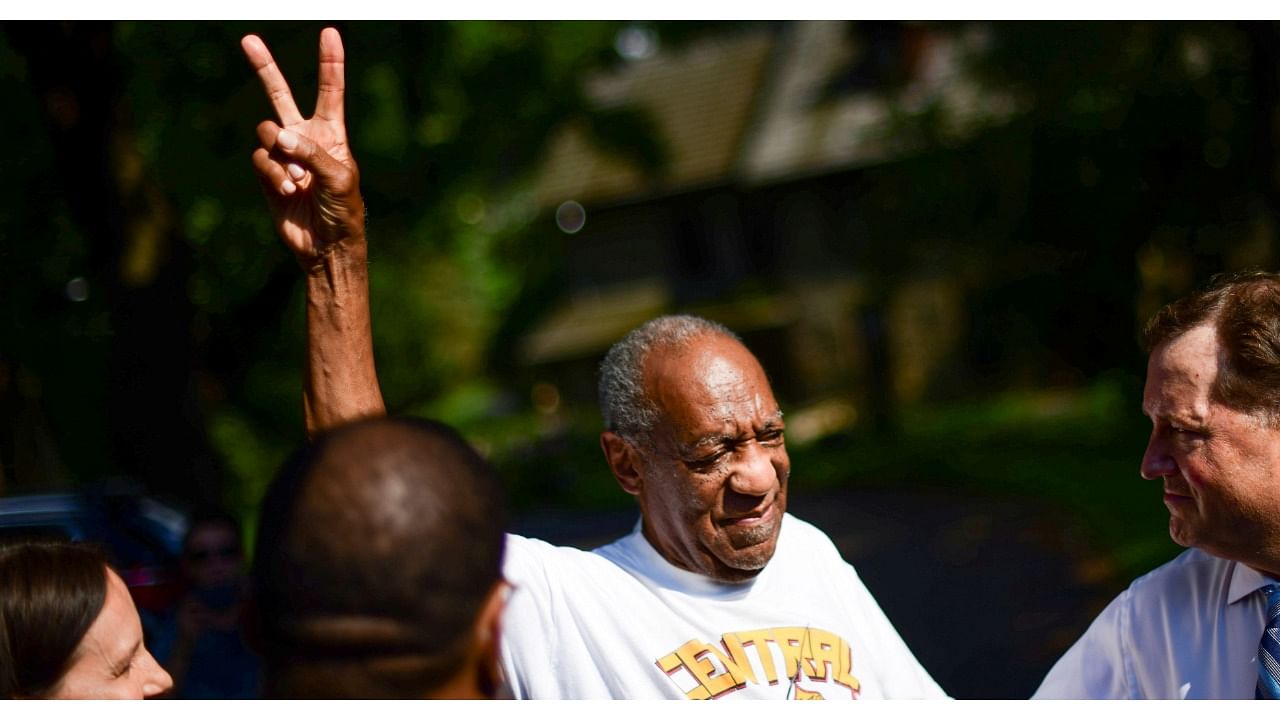 Bill Cosby is welcomed outside his home after Pennsylvania's highest court overturned his sexual assault conviction and ordered him released from prison immediately, in Elkins Park. Credit: Reuters Photo