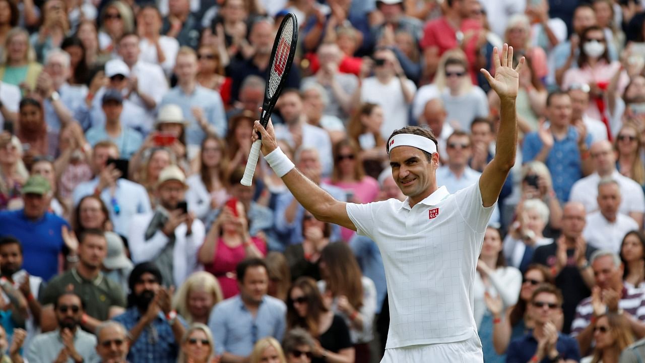 Switzerland's Roger Federer celebrates winning his second round match against France's Richard Gasquet. Credit: Reuters Photo