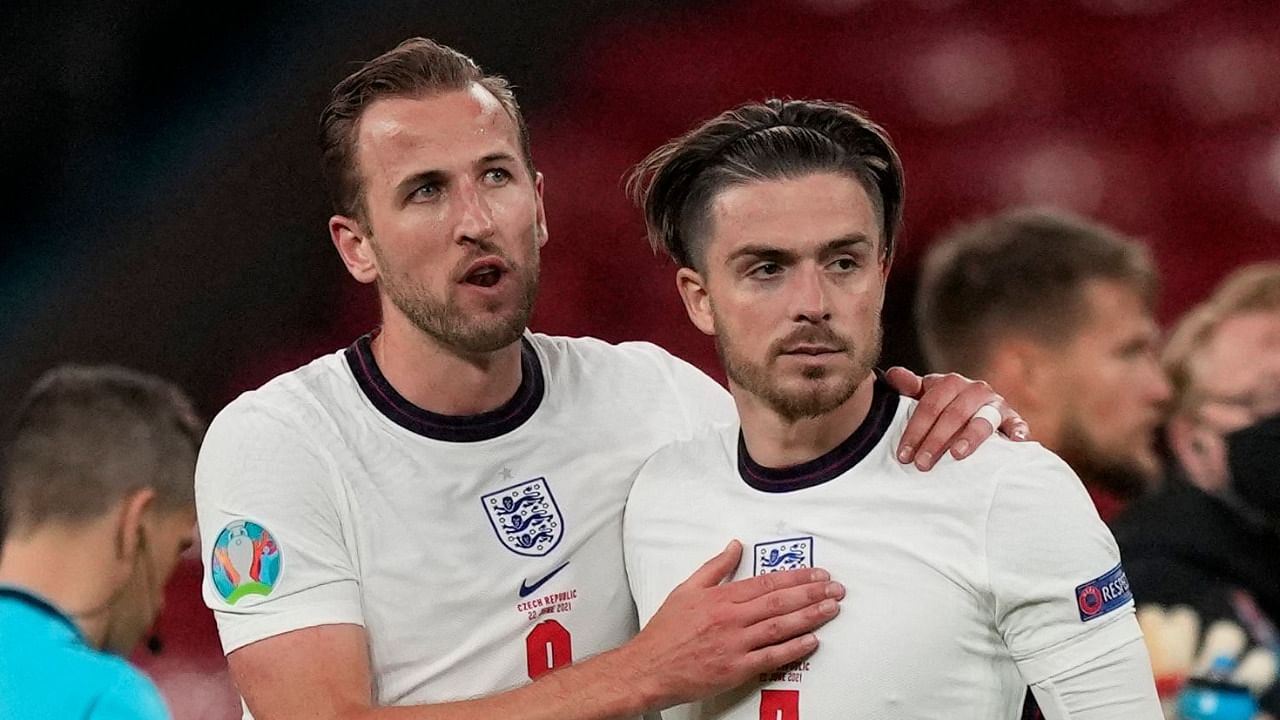 Harry Kane (L) and England team mate Jack Grealish. Credit: AFP File Photo